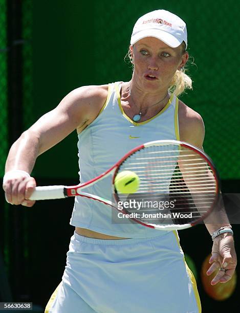 Bryanne Stewart of Australia plays a backhand in her doubles match with Jim Thomas of the USA against Trudi Musgrave and Nathan Healey of Australia...