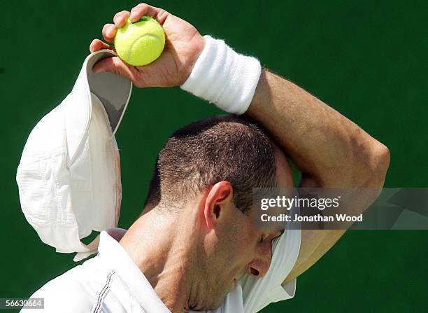 Jim Thomas of the USA feels the heat in his doubles match with Bryanne Stewart of Australia against Trudi Musgrave and Nathan Healey of Australia...