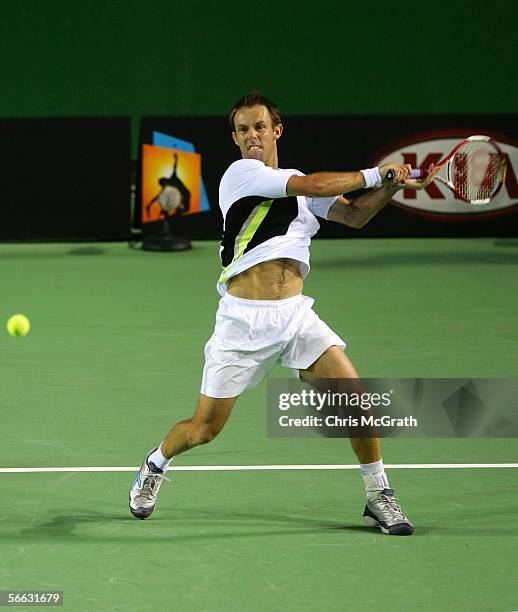 Paul Hanley of South Africa his a forehand in his doubles match with Kevin Ullyett of South Africa against Jeff Coetzee of South Africa and Rogier...