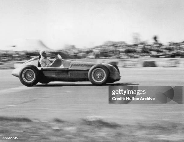 Italian driver Giuseppe Farina on his way to winning the European Grand Prix at Silverstone in his Alfa Romeo Tipo 158, 13th May 1950.