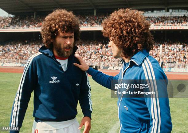 Paul Breitner of Bayern Munich and Kevin Keegan of Hamburg talk before the Bundesliga match between Hamburger SV and Bayern Munich at the...