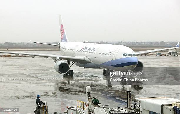 An aircraft of Taiwan-based China Airlines arrives at the tarmac of Shanghai Pudong International Airport for non-stop cross-Straits flight on...