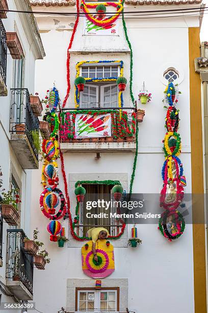 man decorating house in alfama - santos populares imagens e fotografias de stock