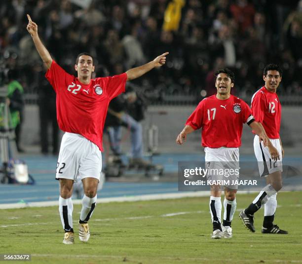 Egyptian players Mohammed Abu Terika jubilates with Hasan Kamel Ahmad and Mohammad Barakat , during the opening football match of the African Nations...