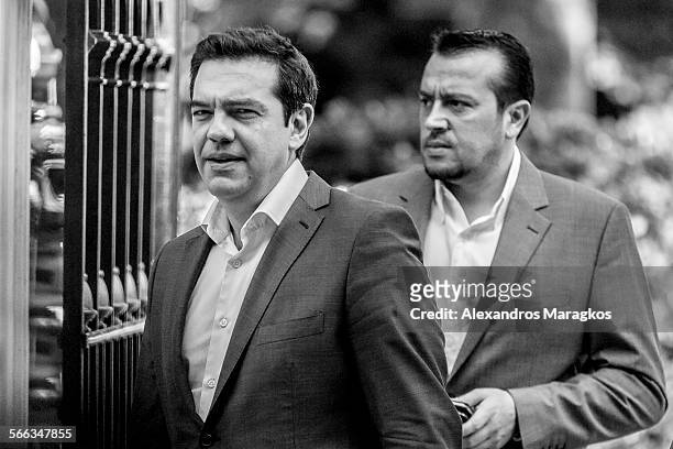 Alexis Tsipras, Greece's Prime Minister, left, and Nikos Pappas, Greece's Minister of State, right, outside the Greek Presidential Palace after...