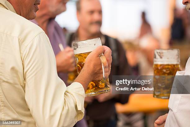 Group of Senior friends cooling off with a cold beer.