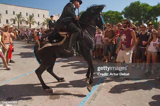 People on the Sant Joan celebration in Ciutadella de Menorca during the summer solstice.