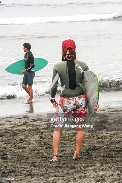 Chigasaki, Kanagawa Prefecture, Japan Surfers on the beach.
