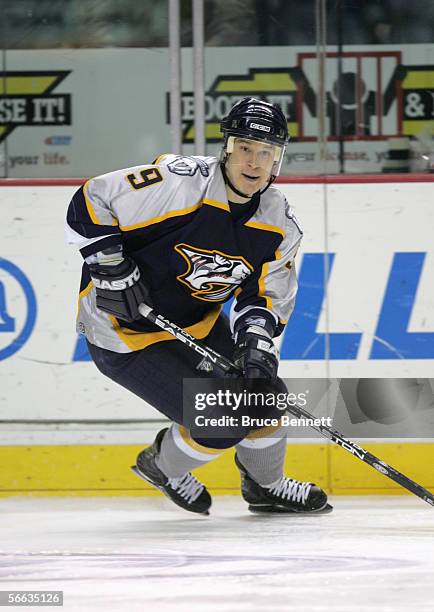 Paul Kariya of the Nashville Predators skates with the puck during the game against the New York Islanders at the Gaylord Enterntainment Center on...