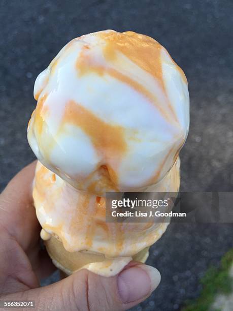 ice cream accidents - orange sorbet stock pictures, royalty-free photos & images