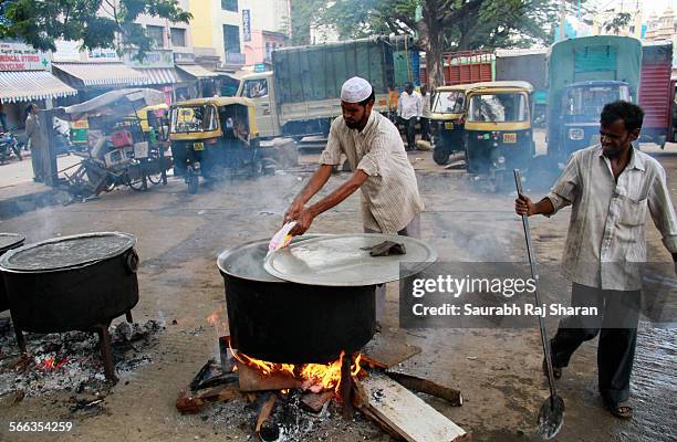 Muslim man preparing Biriyani for evening feast - Iftar during Ramadan 2013