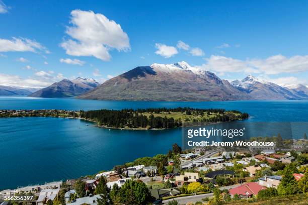 snowcapped mountains and island in lake, queenstown, central otago, new zealand - lake wakatipu stock pictures, royalty-free photos & images