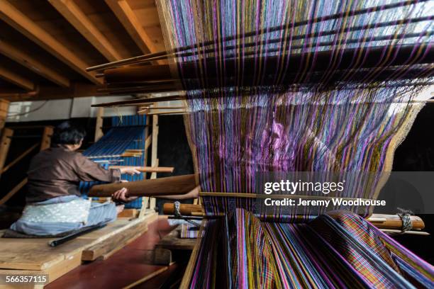 weavers working on traditional looms in studio - thimphu stock pictures, royalty-free photos & images
