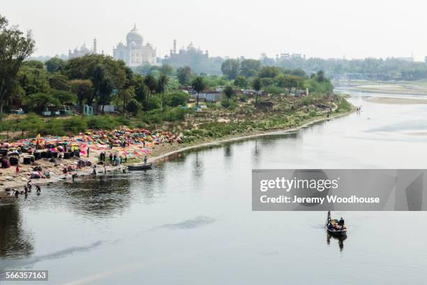 high angle view of boat on yamuna river near taj mahal, agra, uttar pradesh, india - yamuna river bank stock pictures, royalty-free photos & images