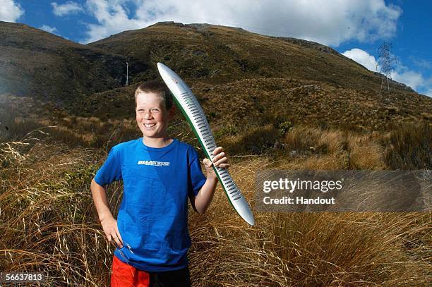 Mackenzie Everist from Huntly Primary School holds the Queen's baton as it crosses over Arthur?s Pass on the west coast, South Island as part of the...