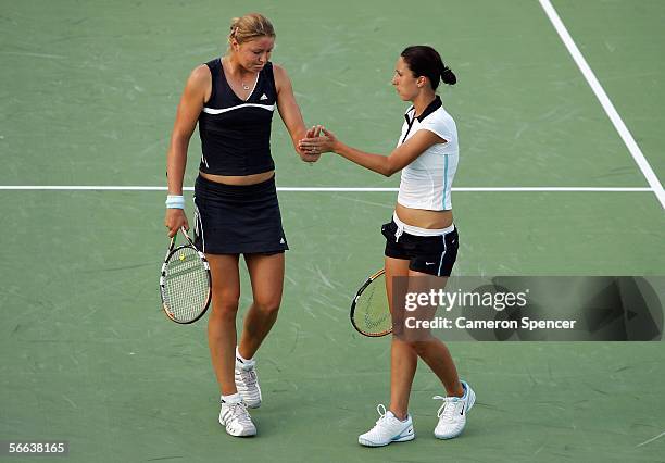 Dinara Safina of Russia and Anastasia Myskina of Russia celebrate a point during their doubles match against Stephanie Foretz of France and Antonella...