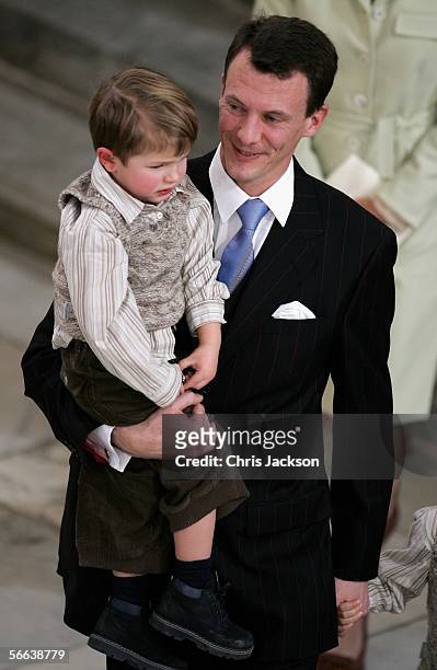 Prince Joachim of Denmark carries his son Prince Felix of Denmark as they leave the Royal Christening of Prince Christian, son of TRH Crown Prince...