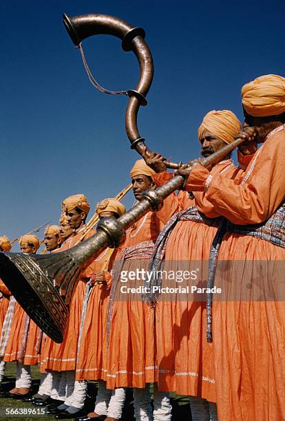 Musicians playing the ranasringa or serpentine horn during the Republic Day celebrations in India, circa 1965. Etty Images)