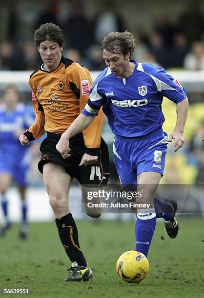 David Livermore of Millwall moves away from Darren Anderton of Wolves during the Coca-Cola Championship match between Millwall and Wolverhampton...