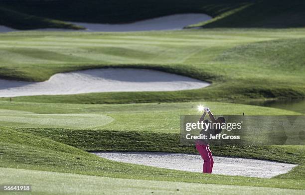 Alex Cejka of Germany hits out of a bunker on the eighteenth hole during the fourth round of the Bob Hope Chrysler Classic at the Classic Club on...