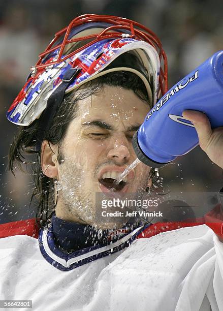Jose Theodore of the Montreal Canadiens takes a cold drink of water after the Vancouver Canucks fifth goal during their NHL game at General Motors...