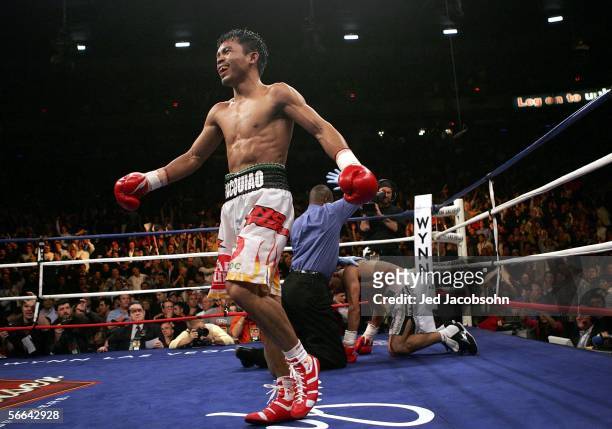 Manny Pacquiao of the Phillippines smiles after knocking out Erik Morales of Mexico in the 10th round during their Super Featherweight Championship...