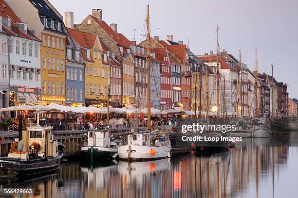 Boats and townhouses along the Nyhavn canal in Copenhagen.