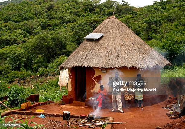 Traditional African hut, with a solar panel on the thatch roof, Venda, Limpopo Province, South Africa.