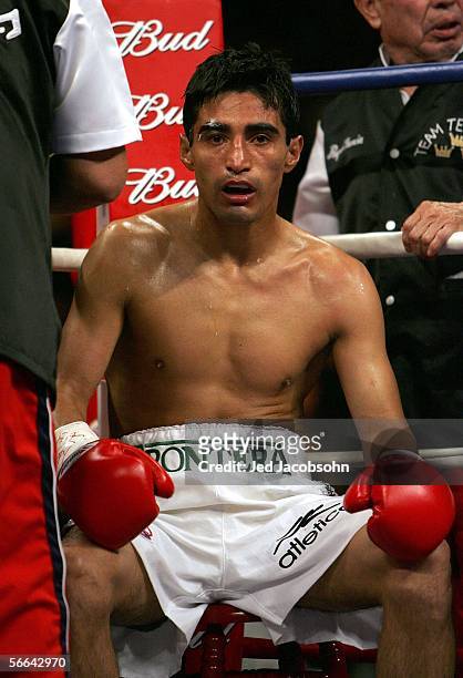 Erik Morales of Mexico sits in his corner before the 10th round of his fight against Manny Pacquiao of the Phillippines during their Super...
