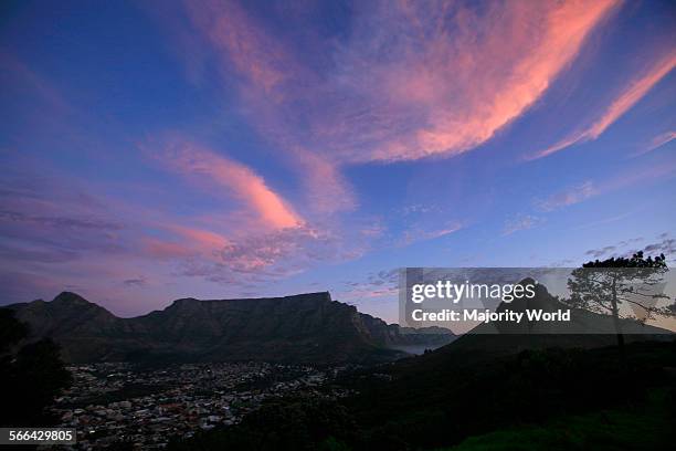 Table Mountain, Lions Head and city bowl at sunset, Cape Town, South Africa.