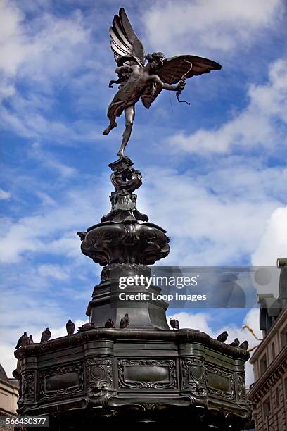 View of the statue of Anteros perched on top of the Shaftesbury Memorial in Piccadilly Circus.