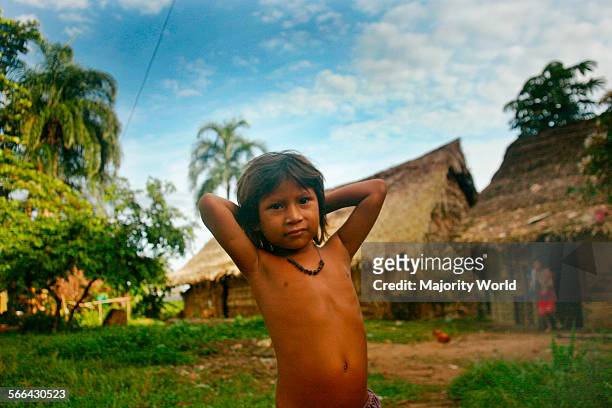 Young boy, from the ethnic Yanomami community near Mavaca river. The Yanomami are an ancient indigenous people living along the Brazilian-Venezuelan...