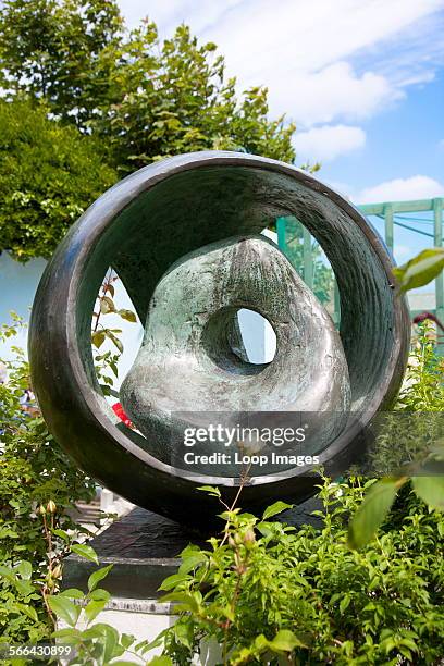 View of Sphere with Inner Form which is one of the sculptures in the Barbara Hepworth Museum garden.