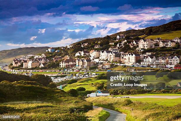 Evening light falls on the English coastal resort town of Woolacombe.