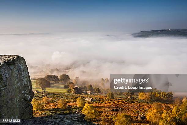 View from Curbar Edge in Derbyshire with autumn mist in the valley.
