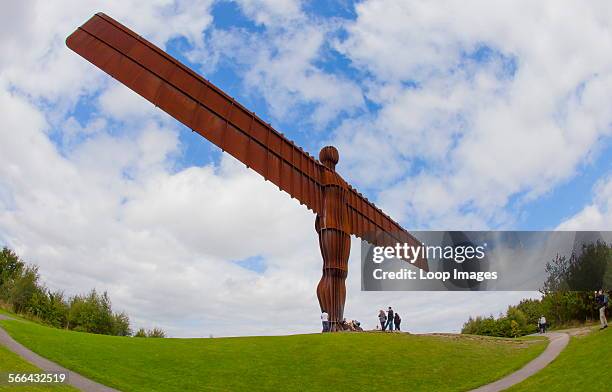 The Angel of the North dwarfs tourists.