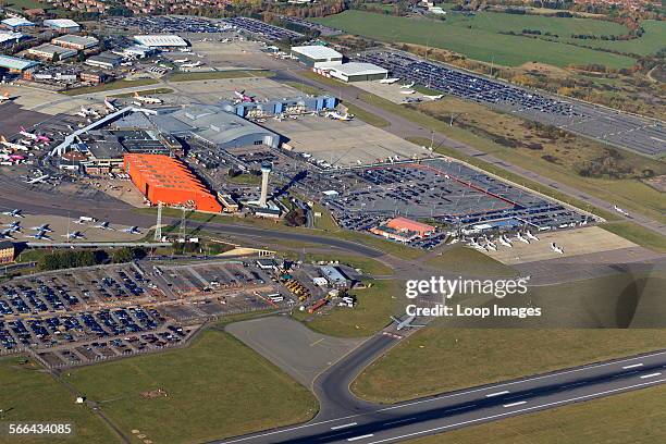 Aerial view of the main terminal with control tower and apron at London Luton Airport.