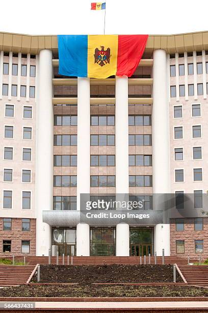 The Moldovan flag draped over the Moldovan parliament building in Chisinau which is the capital of Moldova.