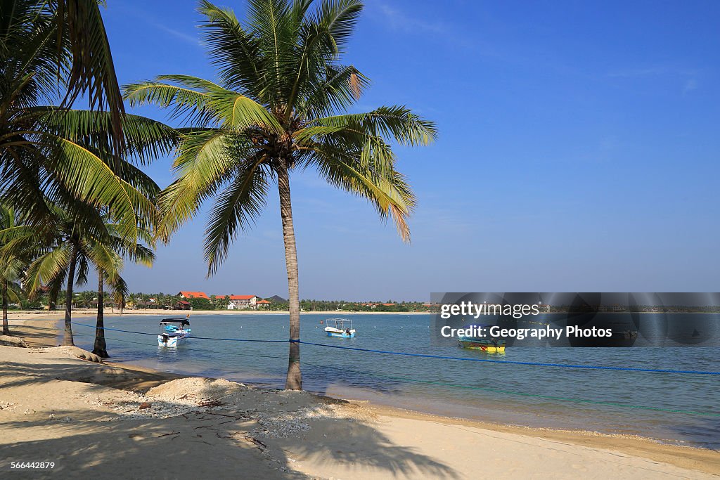 Ocean and sandy tropical beach at Pasikudah Bay, Eastern Province, Sri Lanka