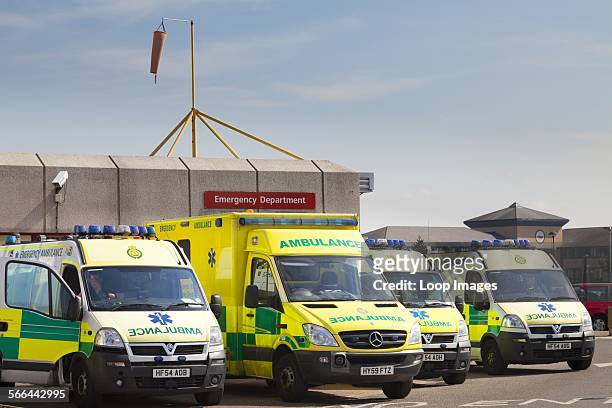 Emergency ambulances parked outside accident and emergency department of Royal Bournemouth Hospital.