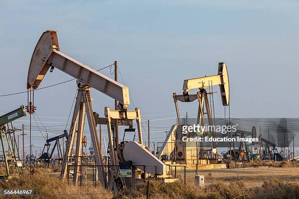 Pump jacks at the Lost Hills Oil Field and hydraulic fracking site. Kern County, San Joaquin Valley, California.