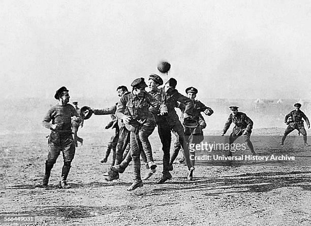British officers and men of 26th Divisional Ammunition Train playing football in Salonika , Greece, a year after the Christmas Truce, 1915.