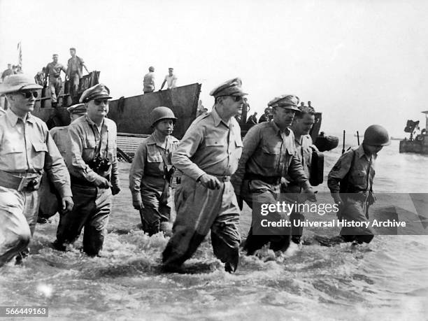 Photograph of General Douglas MacArthur wading ashore during the initial landings in Leyte, Philippine Islands. Dated 1944.