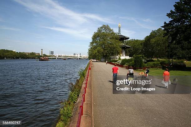 View from the Terrace Walk in Battersea Park down the River Thames towards Chelsea Bridge.