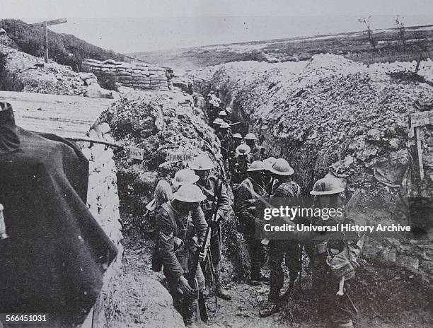 Before the Battle of Albert in July 1916, the 1st Lancashire Fusiliers fix bayonets. This trench is typical of many where the men lived and fought...