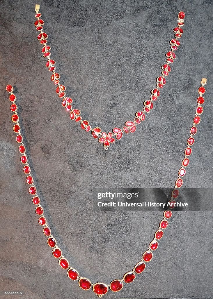 Necklaces with garnets. Brooch with garnets, converted from a pendant.