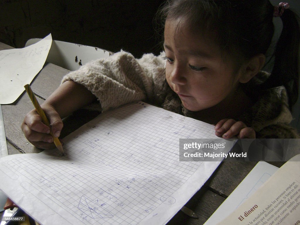 Small peruvian girl doing her homework