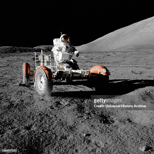 Photograph of Astronaut Eugene A. Crenan, Mission commander, on the Lunar Roving Vehicle, Apollo 17 mission to the moon. Dated 1972.