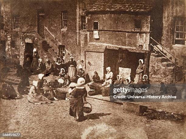 David Octavius Hill and Robert Adamson photograph of women baiting lines for fishing with. Fishergate, North Street, St Andrews, 1845.