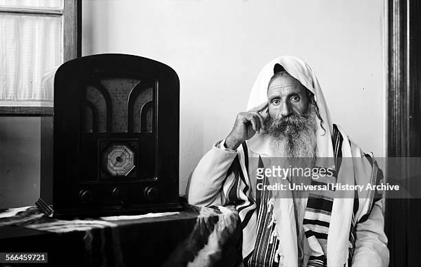 Photograph of a Yemeni Jew listening to a radio in Jerusalem. Dated 1935.